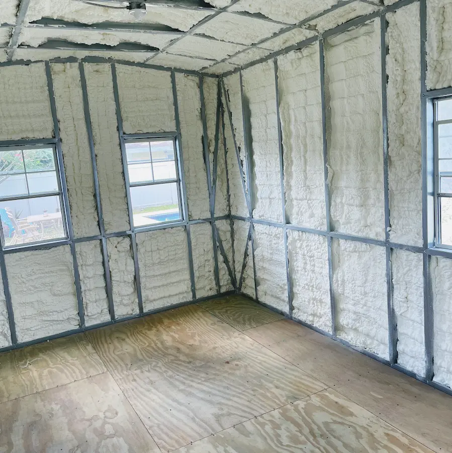 Closed-cell spray foam insulation applied to wall cavities in a residential project in Portage